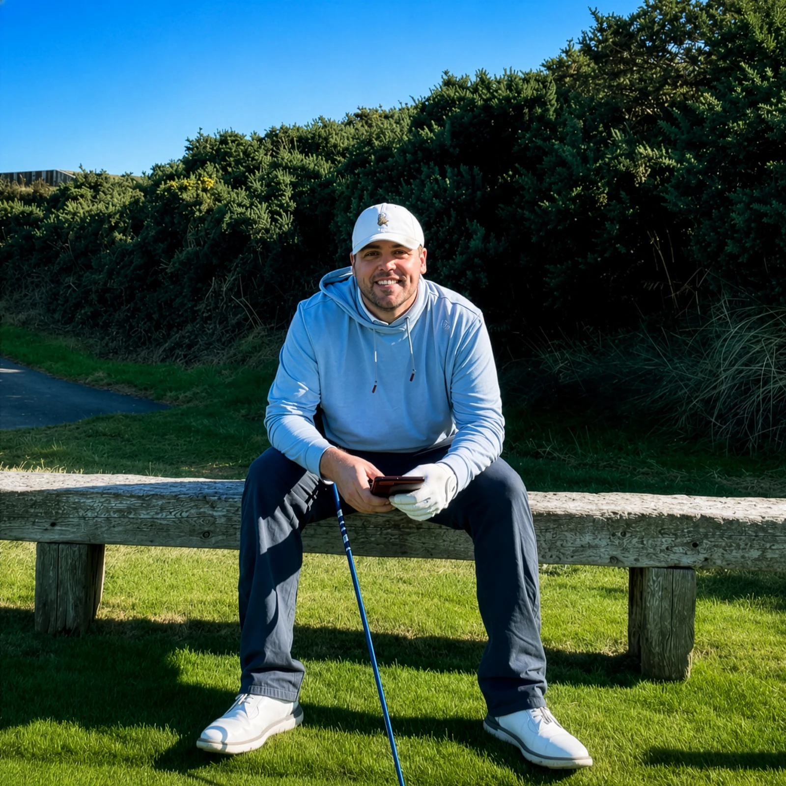 Links and Tide founder seated beside an Irish golf course